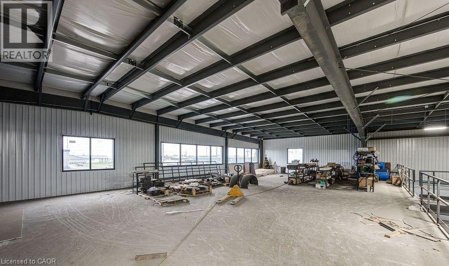 Miscellaneous room featuring metal wall and a garage - 55 Progress Drive E, Aylmer, ON