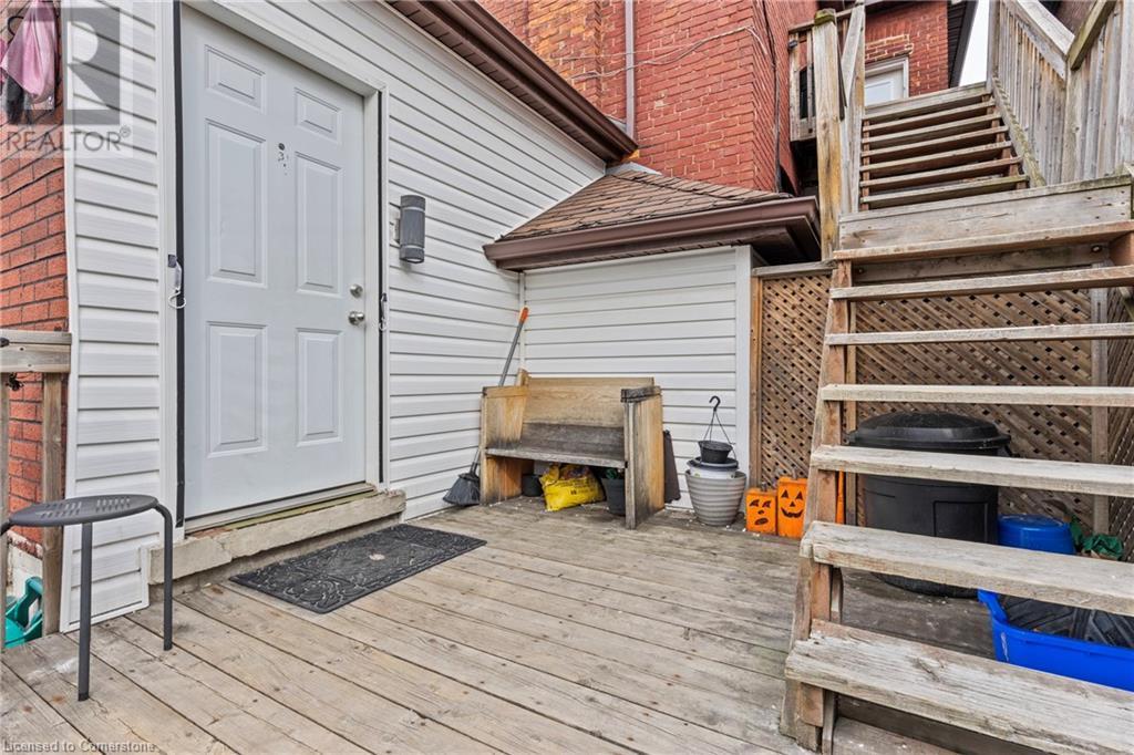 View of wooden terrace - 181 West Avenue N, Hamilton, ON - Outdoor With Exterior