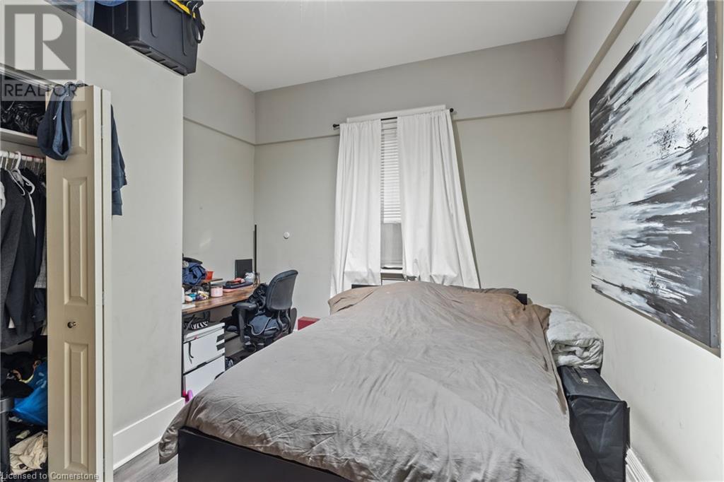 Bedroom featuring wood finished floors - 181 West Avenue N, Hamilton, ON - Indoor Photo Showing Bedroom