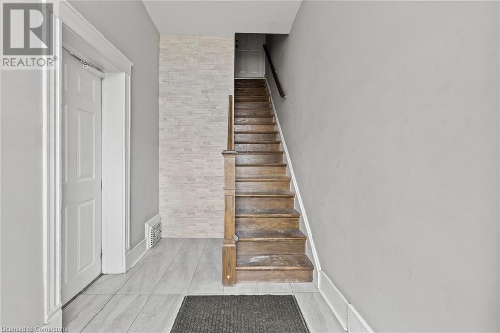 Stairway with tile patterned floors and visible vents - 181 West Avenue N, Hamilton, ON - Indoor Photo Showing Other Room