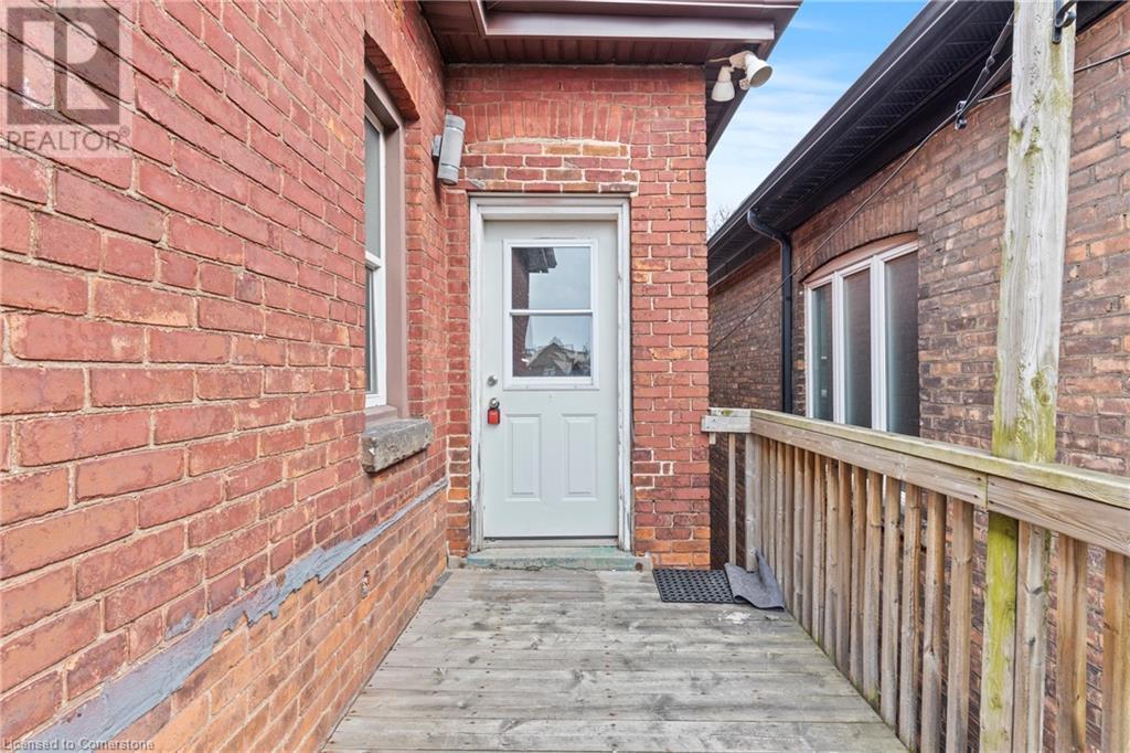 Property entrance with brick siding - 181 West Avenue N, Hamilton, ON - Outdoor With Exterior