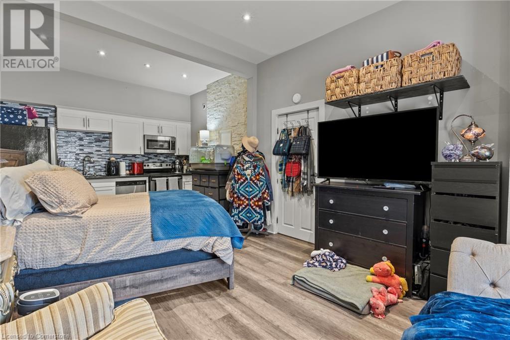 Bedroom with light wood-style flooring, a sink, and recessed lighting - 181 West Avenue N, Hamilton, ON - Indoor Photo Showing Other Room