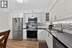 Stainless steel fridge and over the range microwave -