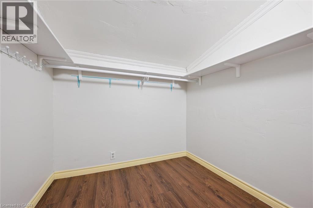 Walk in closet featuring wood finished floors - 41 Rose Street, Kitchener, ON - Indoor Photo Showing Other Room