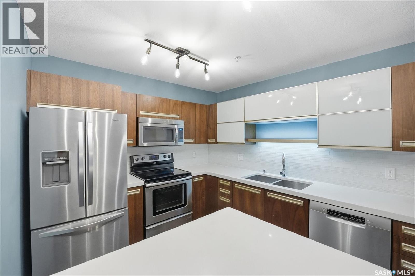 112 130 Phelps Way, Saskatoon, SK - Indoor Photo Showing Kitchen With Double Sink With Upgraded Kitchen