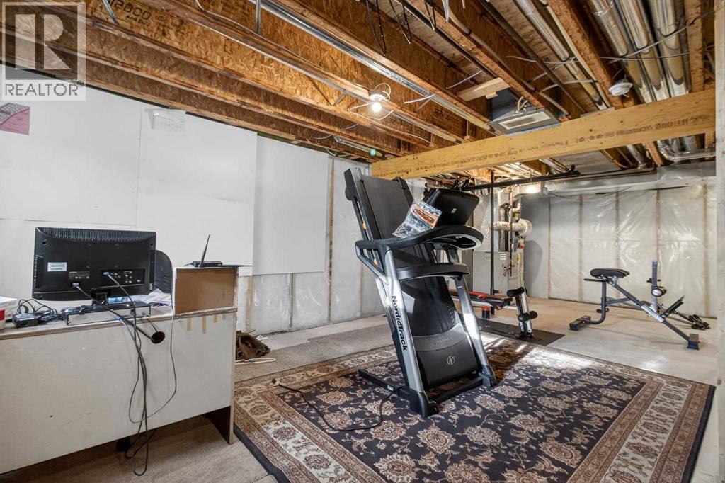 512 Evanston Drive Nw, Calgary, AB - Indoor Photo Showing Gym Room