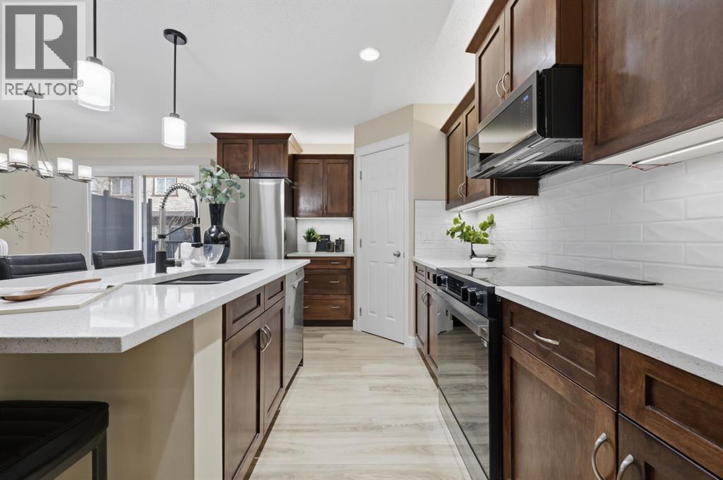 117 Panatella Park Nw, Calgary, AB - Indoor Photo Showing Kitchen With Upgraded Kitchen