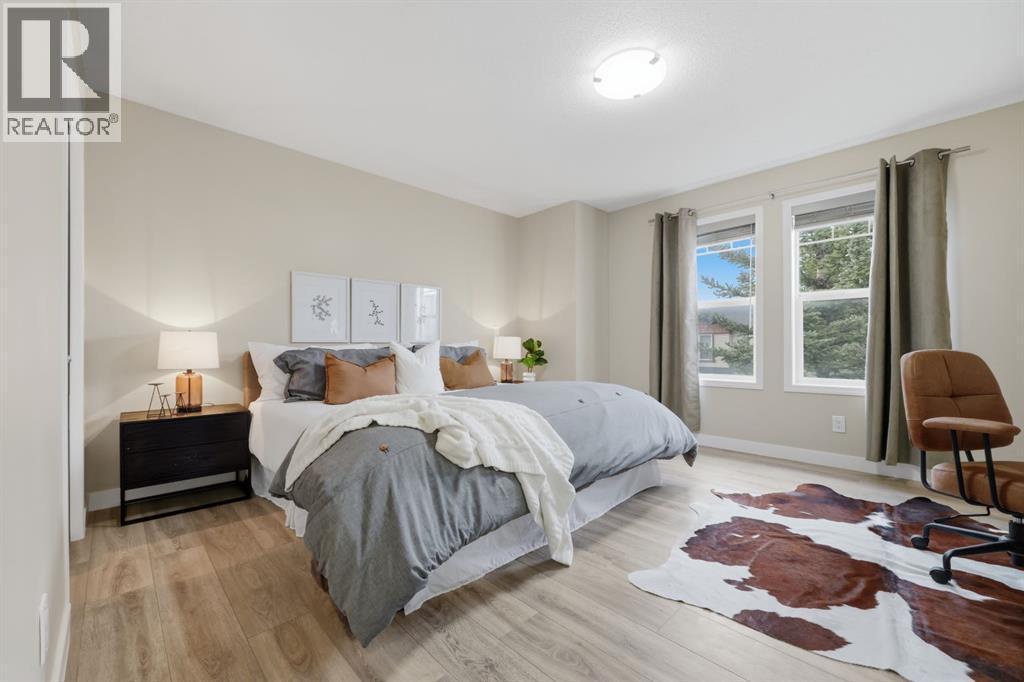 Very spacious bedrooms with lots of natural light - 117 Panatella Park Nw, Calgary, AB - Indoor Photo Showing Bedroom