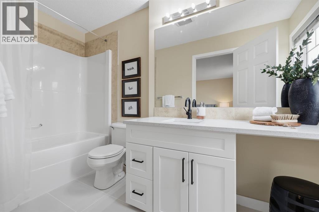 Updated bathrooms throughout - 117 Panatella Park Nw, Calgary, AB - Indoor Photo Showing Bathroom