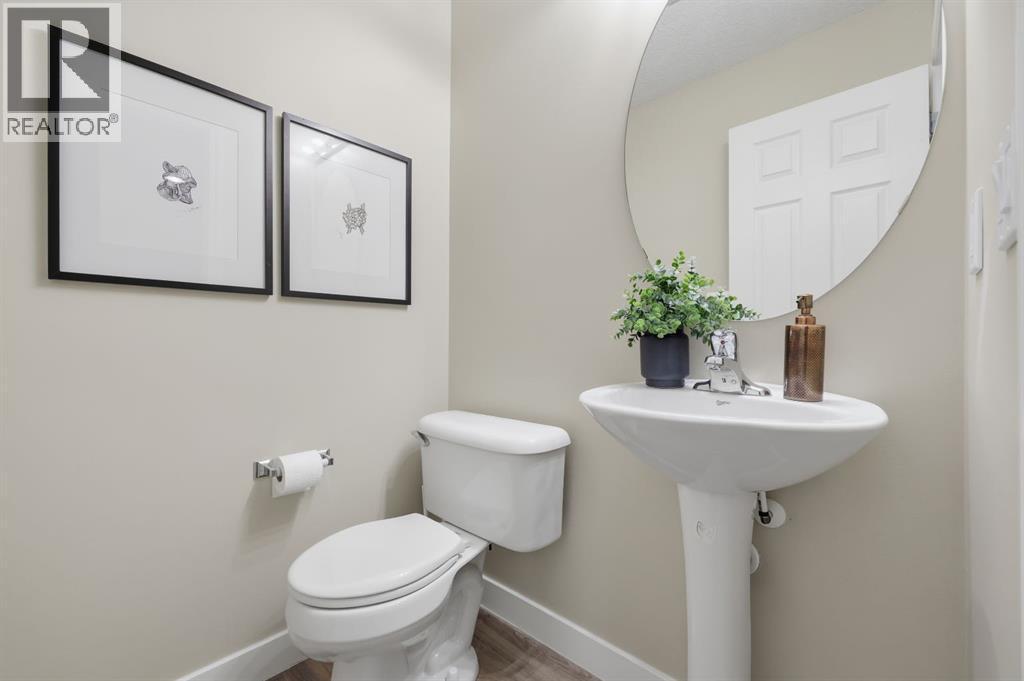 Powder room on main - 117 Panatella Park Nw, Calgary, AB - Indoor Photo Showing Bathroom