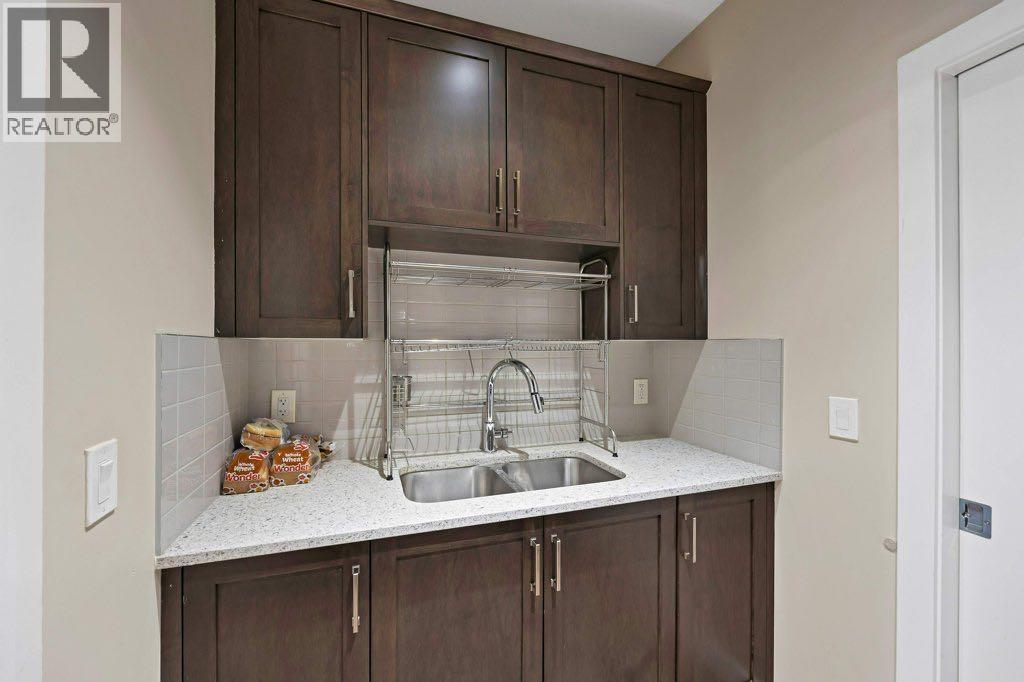 93 Saddlestone Place Ne, Calgary, AB - Indoor Photo Showing Kitchen With Double Sink