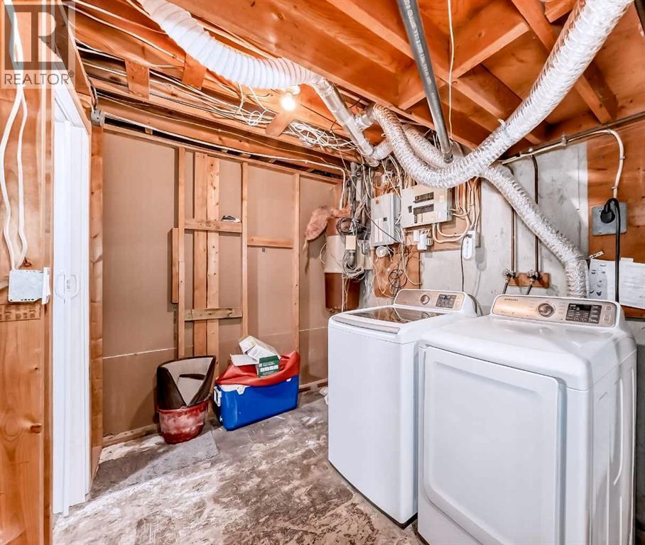 Basement Washer Dryer - 707 Malvern Drive Ne, Calgary, AB - Indoor Photo Showing Laundry Room