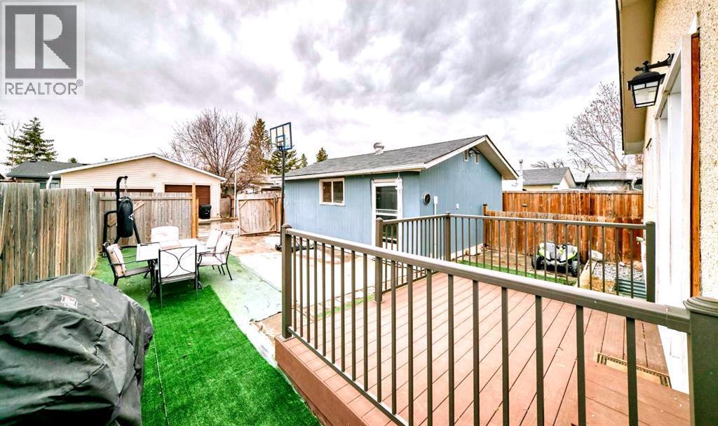 Backyard - 707 Malvern Drive Ne, Calgary, AB - Outdoor With Deck Patio Veranda With Exterior