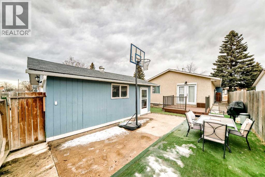 Full view Backyard - 707 Malvern Drive Ne, Calgary, AB - Outdoor With Deck Patio Veranda With Exterior