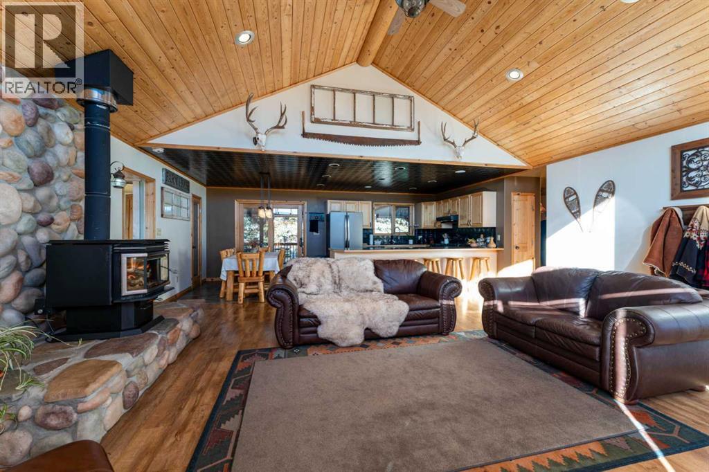 21054 A Range Road 264, Cardston, AB - Indoor Photo Showing Living Room With Fireplace