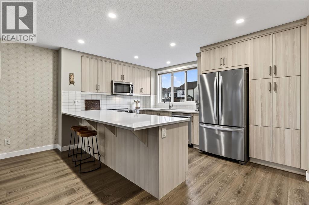 295 Masters Row Se, Calgary, AB - Indoor Photo Showing Kitchen With Upgraded Kitchen