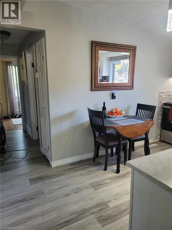 Dining space featuring light wood-type flooring and baseboards - 89 Deschene Avenue, Hamilton, ON - Indoor Photo Showing Dining Room