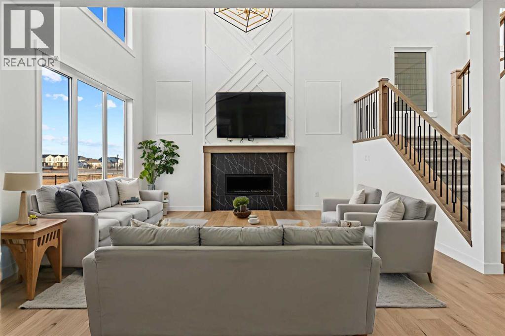 8 Ranchers Meadows, Okotoks, AB - Indoor Photo Showing Living Room With Fireplace