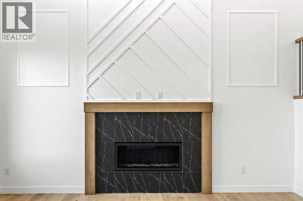 8 Ranchers Meadows, Okotoks, AB - Indoor With Fireplace