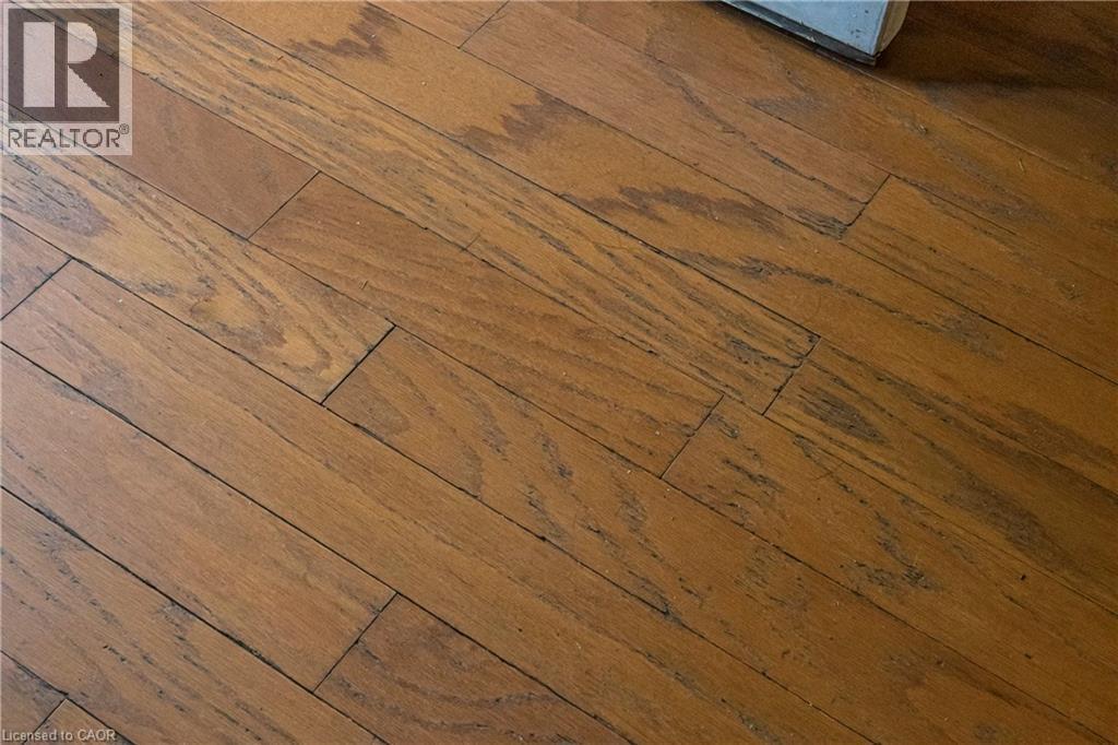 Detailed view of wood finished floors - 23 Frederick Avenue, Hamilton, ON - Photo Showing Other Room