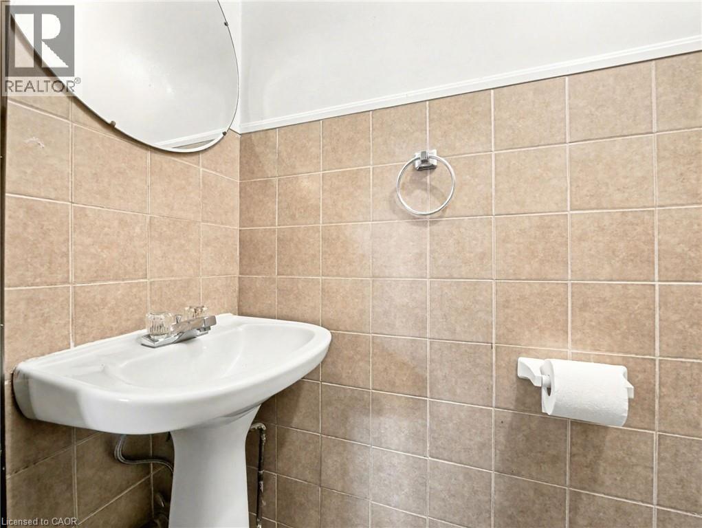 Bathroom featuring tile walls - 23 Oak Avenue, Hamilton, ON - Indoor Photo Showing Bathroom
