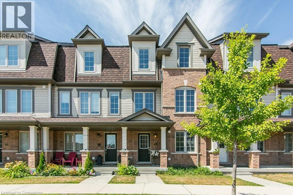 View of front of house with a shingled roof, covered porch, and brick siding - 386 Linden Drive, Cambridge, ON - Outdoor With Deck Patio Veranda With Facade