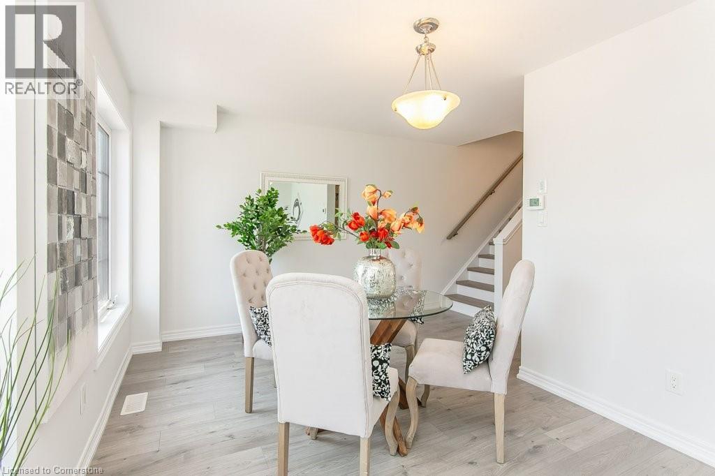 Dining room featuring stairway and light wood-type flooring - 386 Linden Drive, Cambridge, ON - Indoor Photo Showing Dining Room