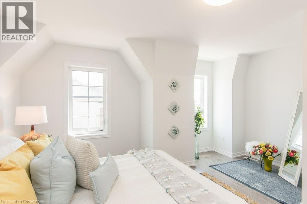 Primary Bedroom with light wood-type flooring and baseboards - 386 Linden Drive, Cambridge, ON - Indoor Photo Showing Bedroom