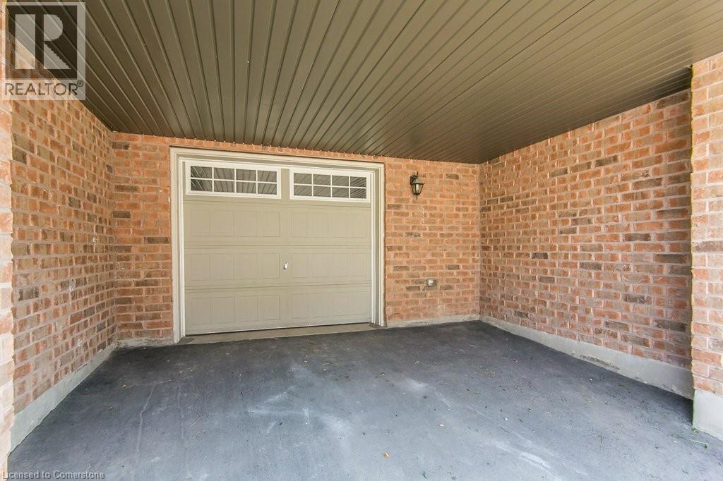 Garage featuring driveway - 386 Linden Drive, Cambridge, ON - With Exterior