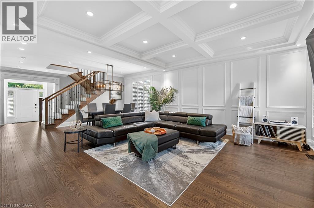 Living area featuring stairs, dark wood-style flooring, recessed lighting, coffered ceiling, and beam ceiling - 18 David Avenue, Hamilton, ON - Indoor