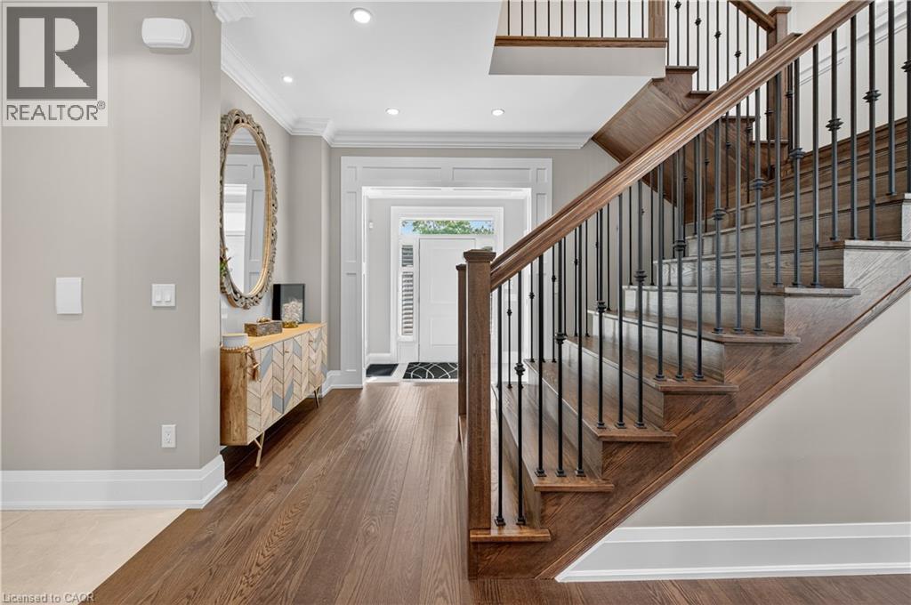 Entryway with crown molding, dark wood-type flooring, and recessed lighting - 18 David Avenue, Hamilton, ON - Indoor Photo Showing Other Room