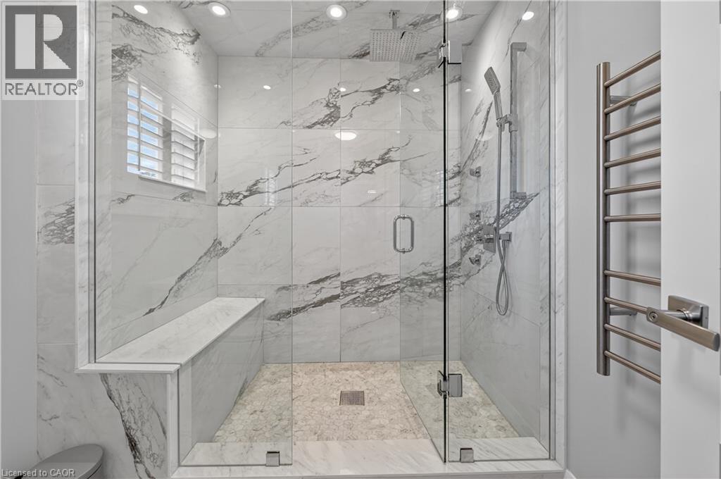 Full bath with a towel warming rack and a marble finish shower - 18 David Avenue, Hamilton, ON - Indoor Photo Showing Bathroom