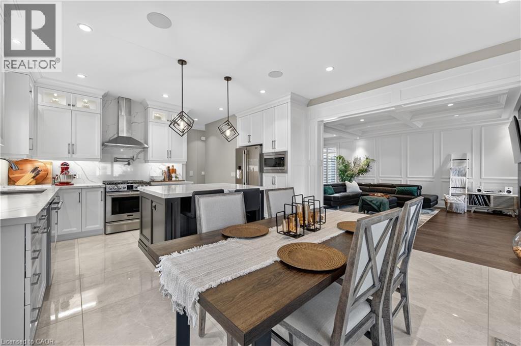 Dining space featuring a decorative wall, recessed lighting, coffered ceiling, and beam ceiling - 18 David Avenue, Hamilton, ON - Indoor Photo Showing Dining Room