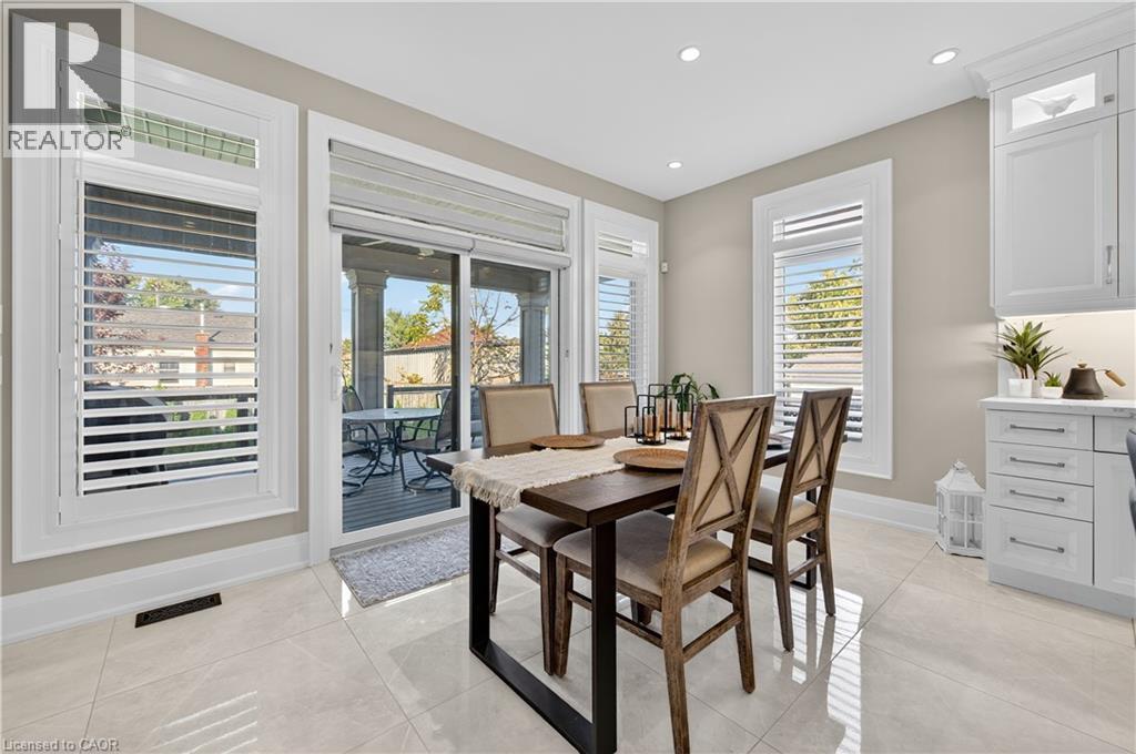 Dining room with light tile patterned flooring and recessed lighting - 18 David Avenue, Hamilton, ON - Indoor Photo Showing Dining Room