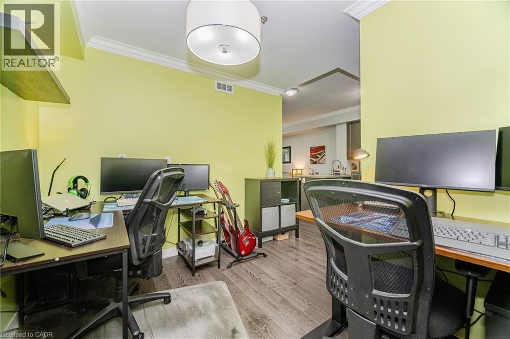 Office area featuring ornamental molding and wood finished floors - 5317 Upper Middle Road Unit# 112, Burlington, ON - Indoor Photo Showing Office