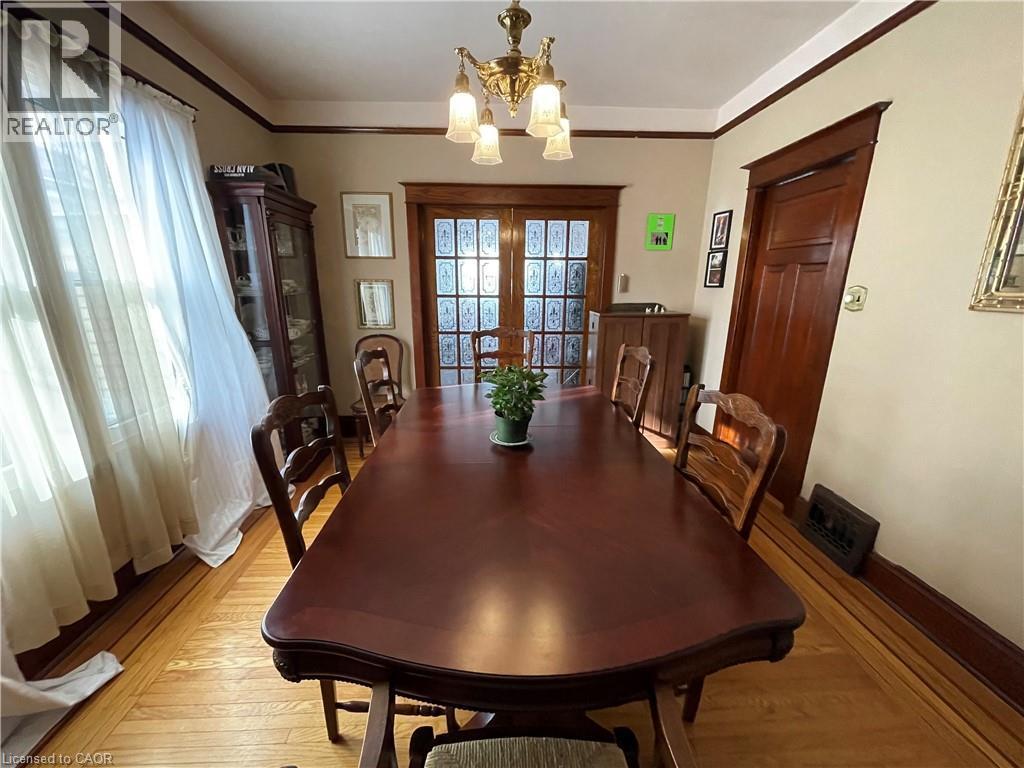 Double etched glass pocket doors into LR - 25 Fairmount Avenue, Hamilton, ON - Indoor Photo Showing Dining Room