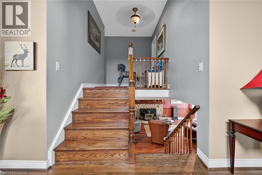 Staircase with wood finished floors and baseboards - 5590 Blind Line, Burlington, ON - Indoor Photo Showing Other Room
