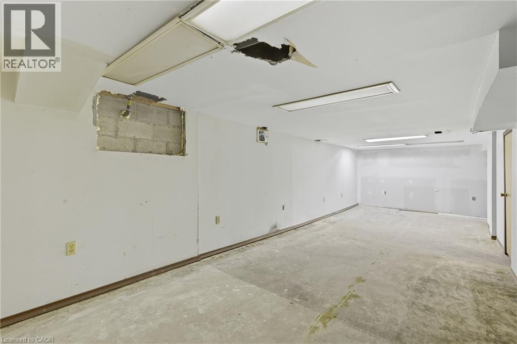 Spare room featuring concrete flooring - 1036 Upper Wentworth Street, Hamilton, ON