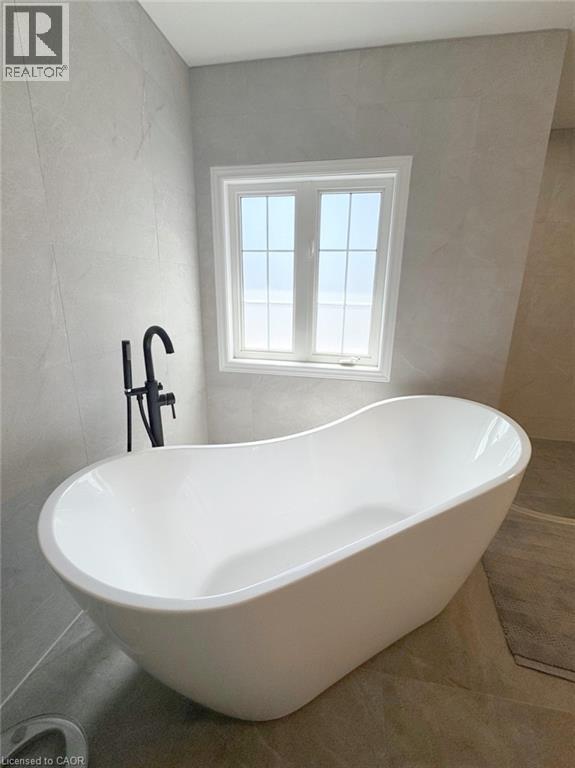 Full bathroom with a freestanding tub and tile walls - 2429 Whitehorn Drive, Burlington, ON - Indoor Photo Showing Bathroom