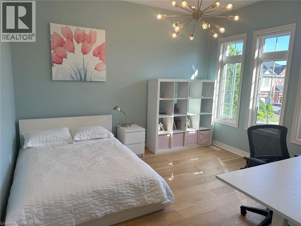 Bedroom featuring wood finished floors, a chandelier, and a desk - 2429 Whitehorn Drive, Burlington, ON - Indoor Photo Showing Bedroom