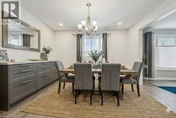 Virtually staged dining room. -