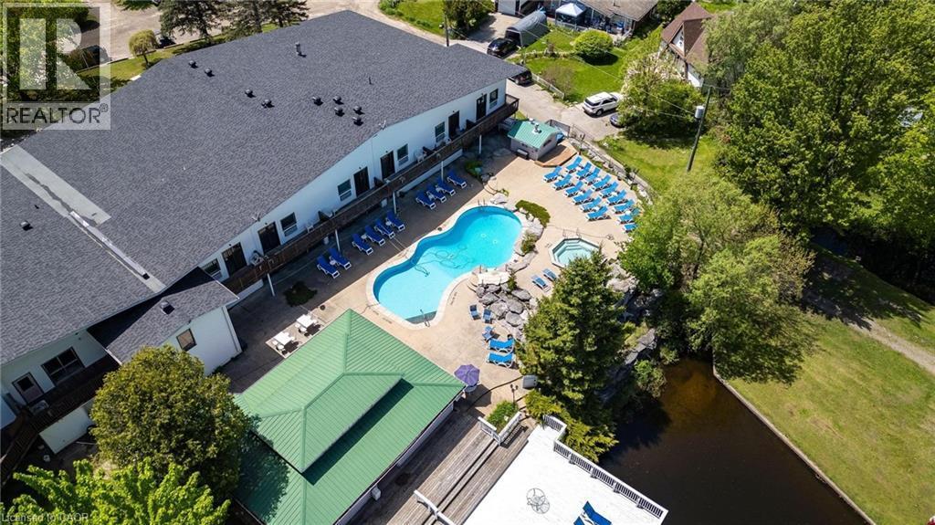 Aerial view of a pool area - 57 12Th Conc Road E Unit# 430, Flamborough, ON - Outdoor With In Ground Pool With View