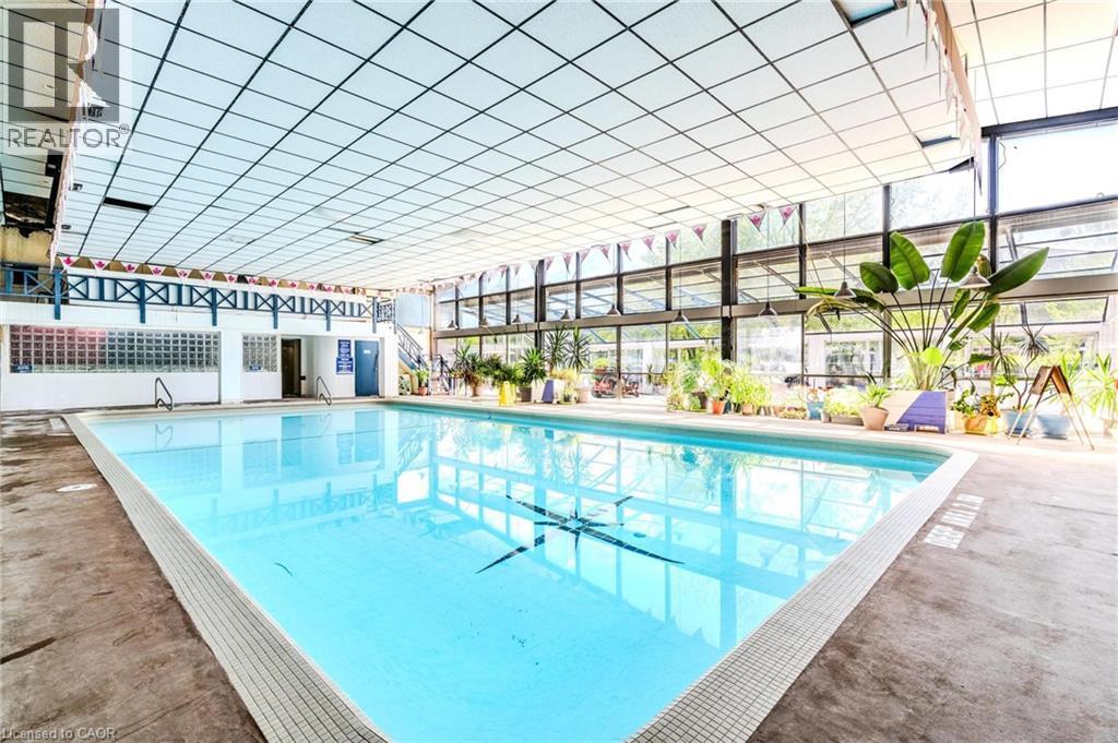 Indoor community pool with a patio - 57 12Th Conc Road E Unit# 430, Flamborough, ON - Indoor Photo Showing Other Room With In Ground Pool