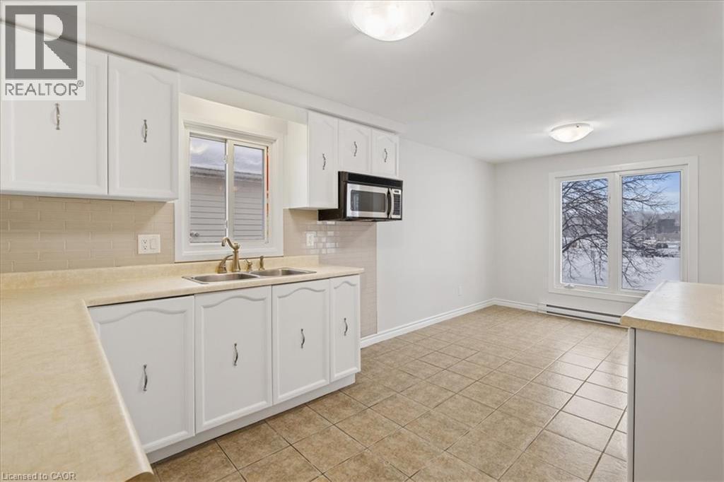 67 Old Carriage Drive, Kitchener, ON - Indoor Photo Showing Kitchen With Double Sink