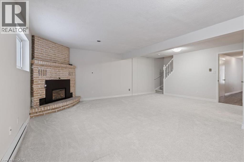 67 Old Carriage Drive, Kitchener, ON - Indoor With Fireplace
