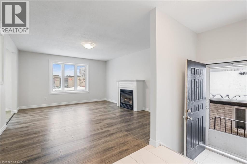 67 Old Carriage Drive, Kitchener, ON - Indoor With Fireplace