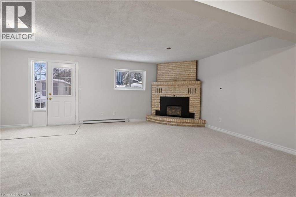 67 Old Carriage Drive, Kitchener, ON - Indoor With Fireplace