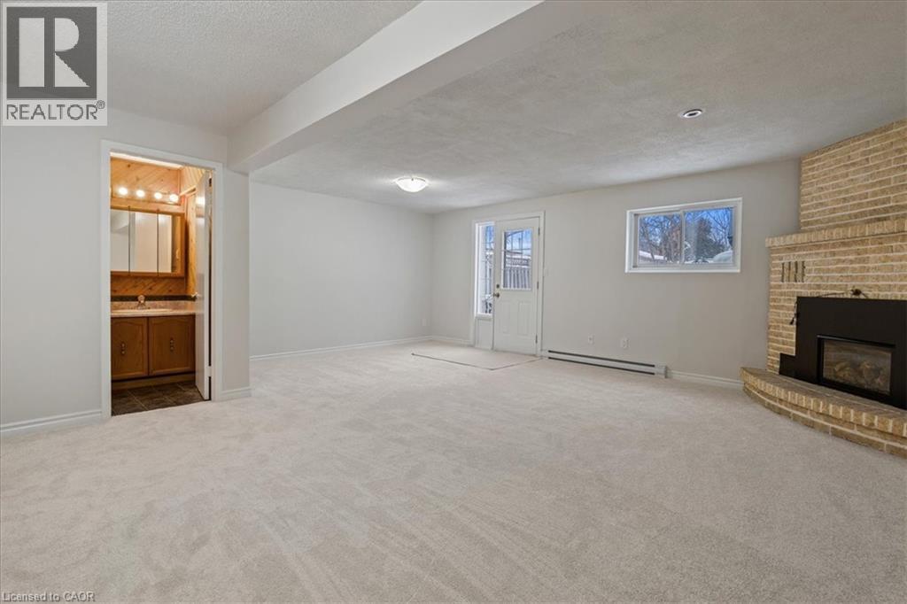 67 Old Carriage Drive, Kitchener, ON - Indoor With Fireplace