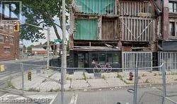 View of building exterior featuring fence -