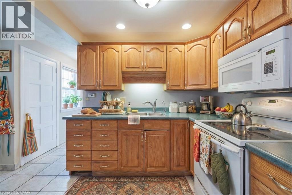 Virtually Staged - 92 Gary Avenue, Hamilton, ON - Indoor Photo Showing Kitchen With Double Sink
